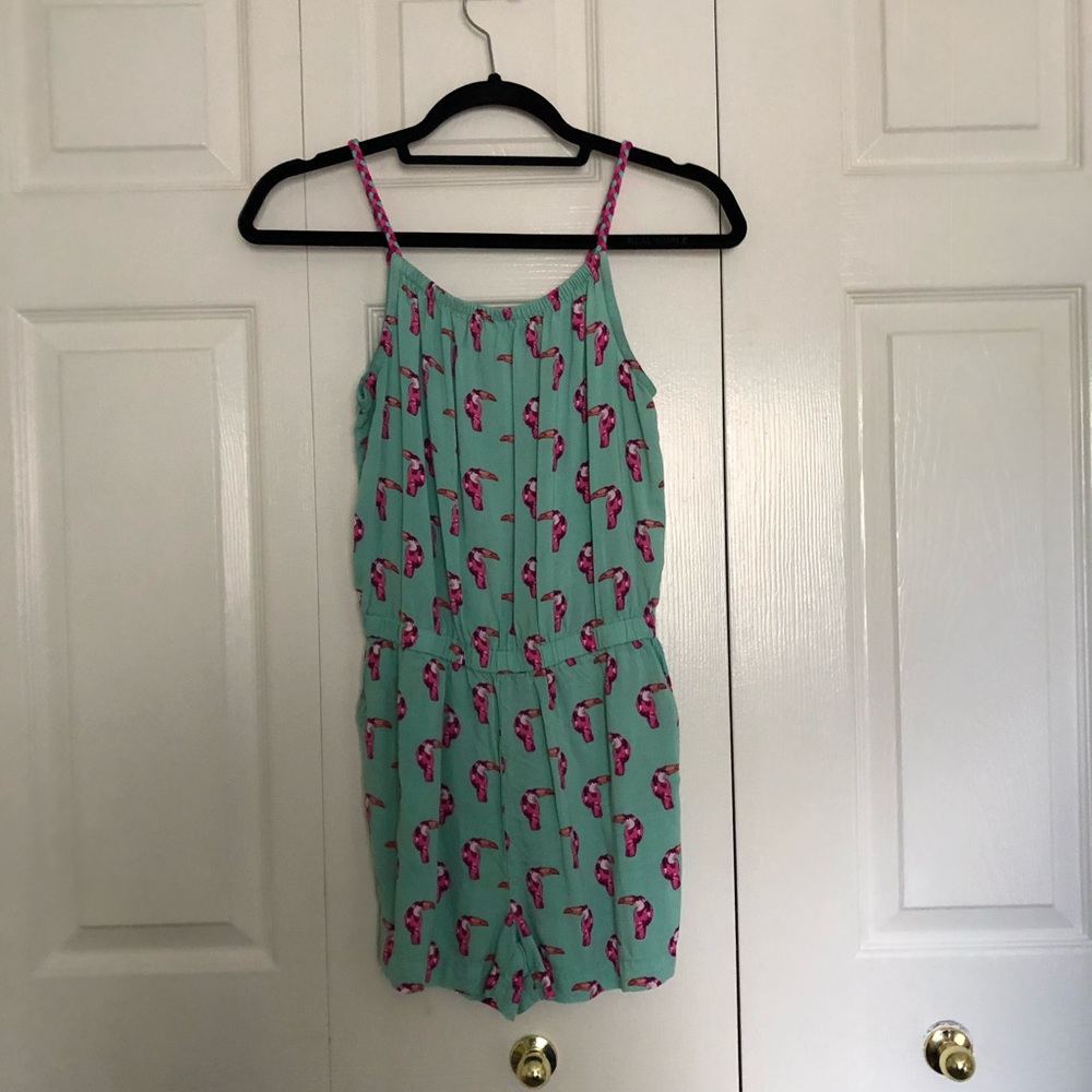 A teal toucan romper.